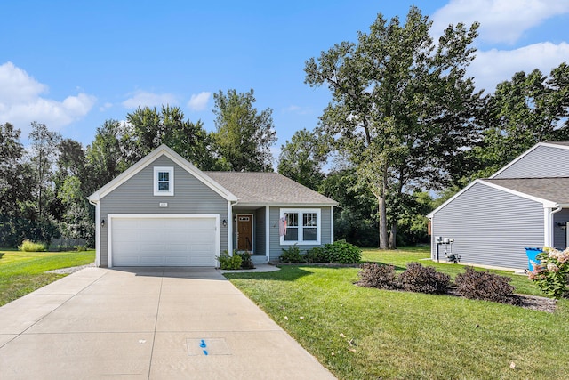 view of front of house featuring a garage and a front lawn