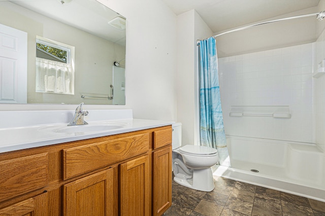 bathroom featuring a shower with curtain, toilet, and vanity