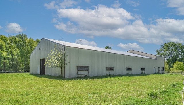 view of side of home featuring a yard