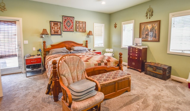 carpeted bedroom featuring access to outside