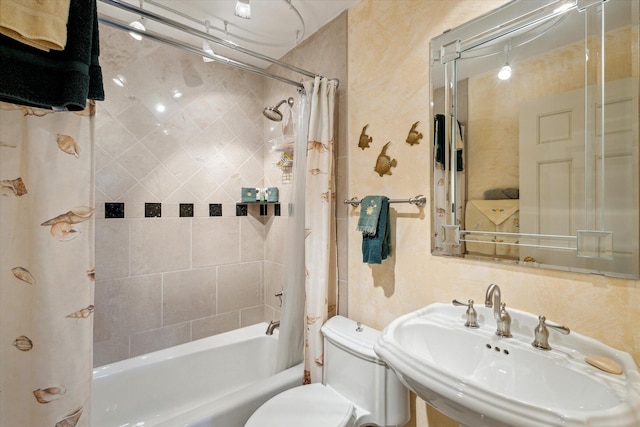 full bathroom with toilet, sink, and shower / tub combo