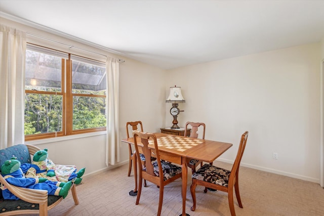 dining area with light carpet