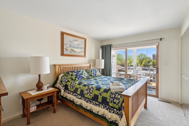 bedroom featuring french doors, access to outside, and light colored carpet