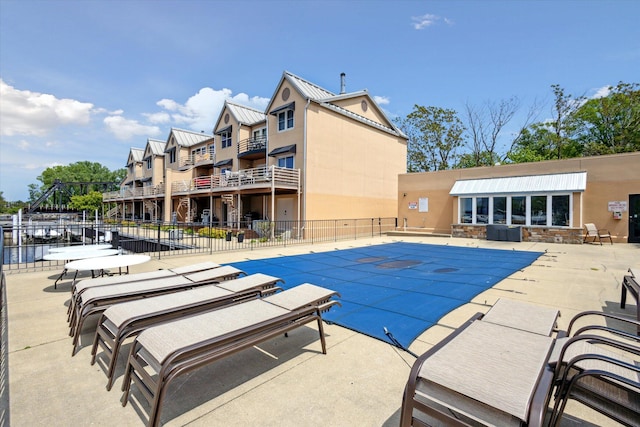 view of swimming pool with a patio area