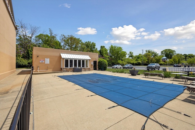 view of swimming pool featuring a patio