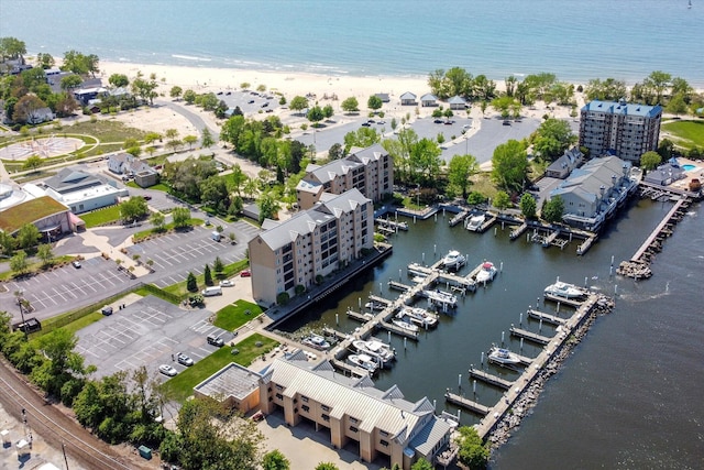 bird's eye view featuring a view of the beach and a water view