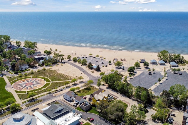 bird's eye view featuring a water view and a view of the beach