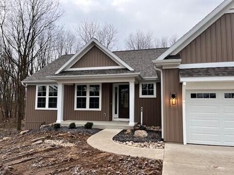 view of front of home with a garage and covered porch