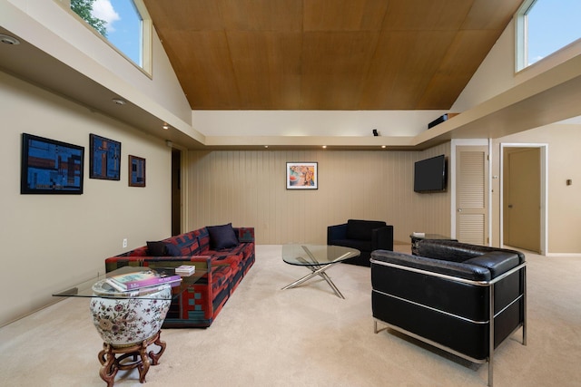 living room featuring wooden ceiling, carpet, and a towering ceiling