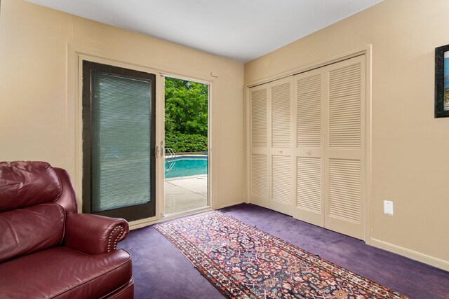 sitting room featuring carpet floors