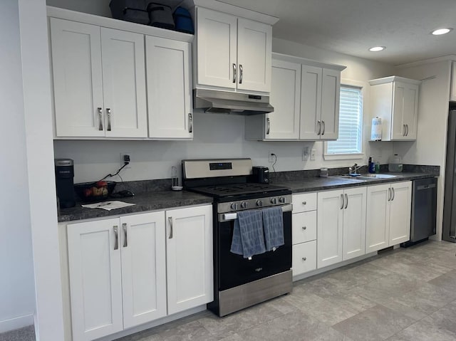 kitchen with stainless steel appliances, white cabinets, sink, and light tile floors