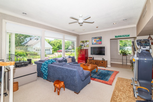 carpeted living room with ceiling fan