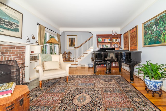 living room featuring a fireplace and wood-type flooring