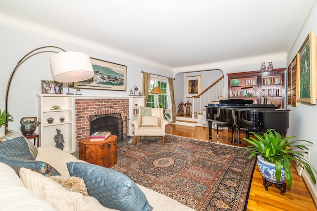 living room with hardwood / wood-style floors and a fireplace