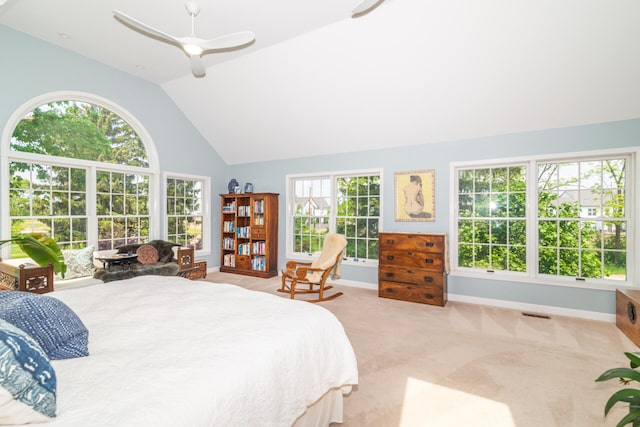 bedroom with multiple windows, high vaulted ceiling, carpet floors, and ceiling fan