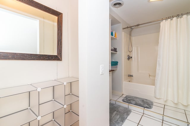 bathroom featuring shower / bath combination with curtain and tile floors