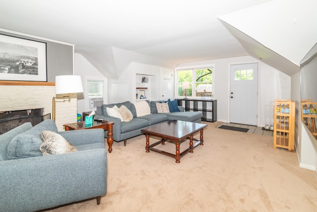 carpeted living room featuring vaulted ceiling and a fireplace