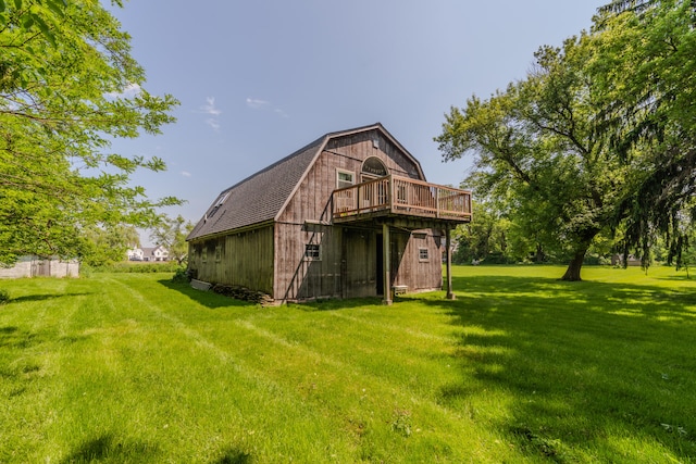 rear view of house featuring a lawn