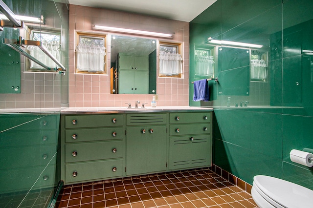 bathroom featuring toilet, tasteful backsplash, vanity, and tile patterned floors