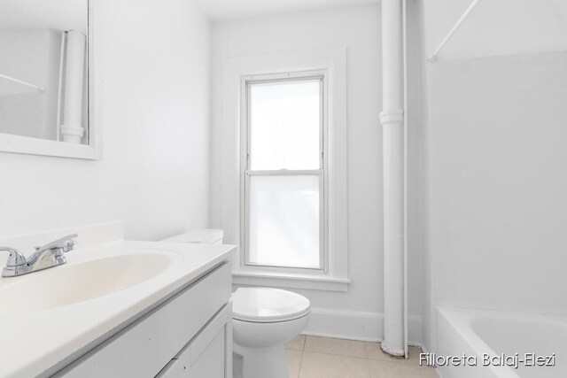 full bathroom with tile flooring, bathing tub / shower combination, vanity, and toilet