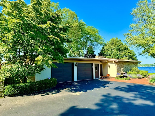 single story home with a garage