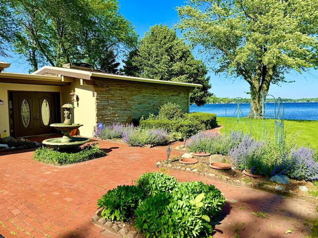 view of patio / terrace with a water view