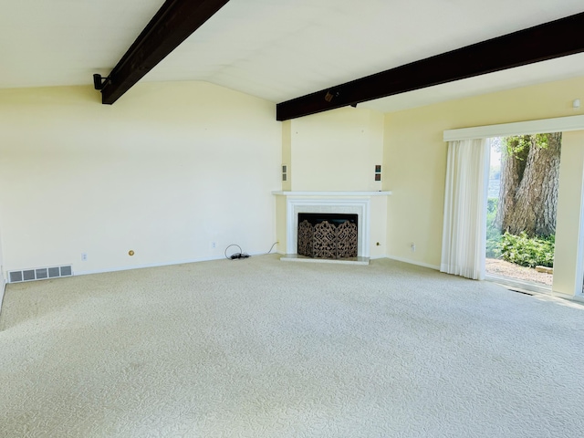 unfurnished living room with carpet and vaulted ceiling with beams