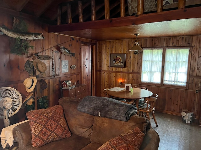 interior space with wooden walls and vaulted ceiling