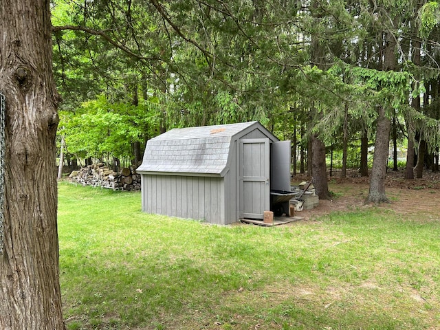 view of outdoor structure with a lawn