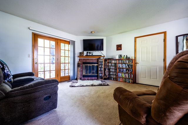 living room with carpet flooring and a fireplace