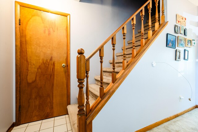 stairway featuring tile patterned floors