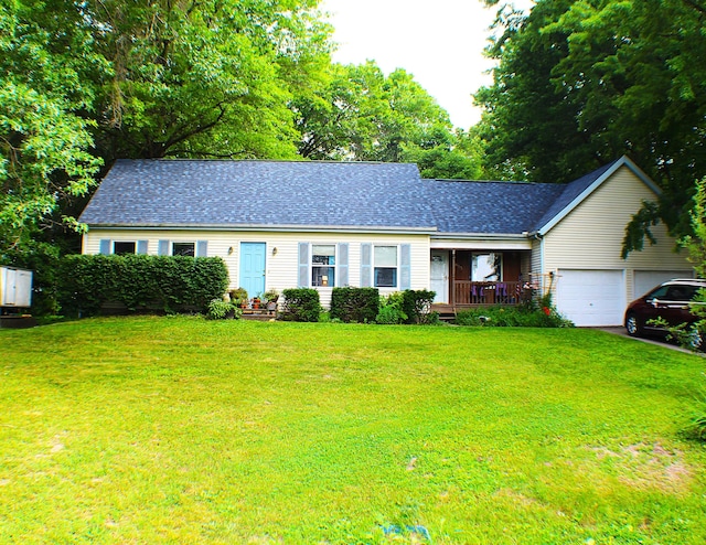 single story home featuring a front lawn and a garage