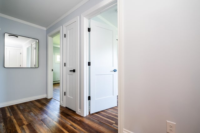 hallway featuring a baseboard radiator, dark hardwood / wood-style flooring, and ornamental molding