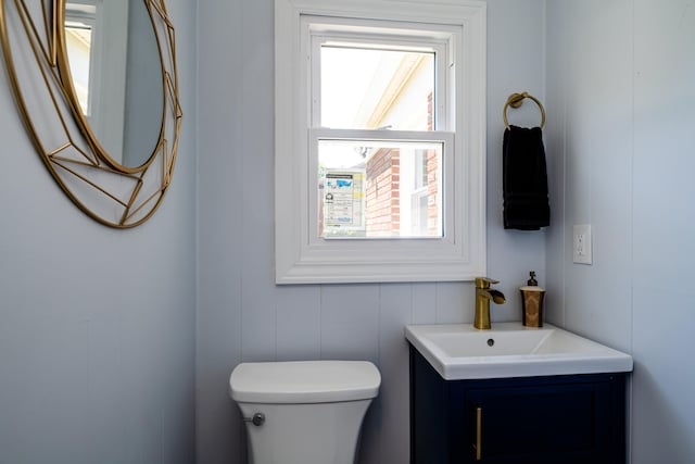 bathroom featuring toilet and vanity