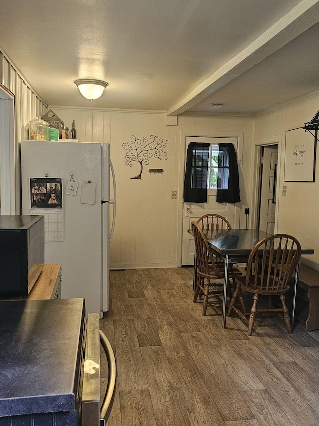 kitchen featuring wooden counters, white refrigerator, and hardwood / wood-style floors