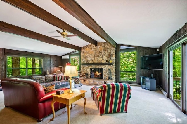 living room featuring lofted ceiling with beams, light colored carpet, and a healthy amount of sunlight