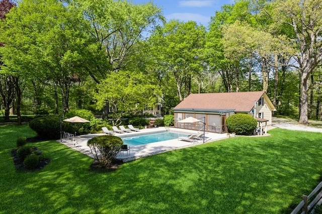 view of pool featuring a yard and a patio