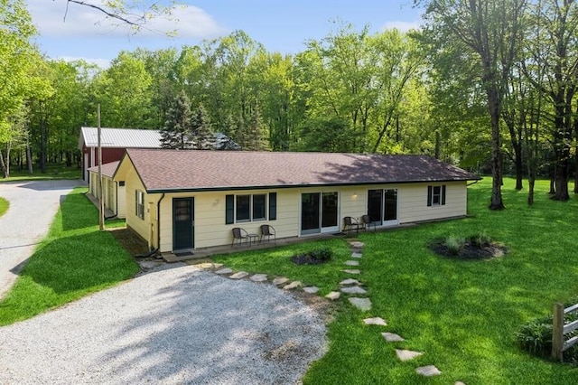 ranch-style home with a front yard