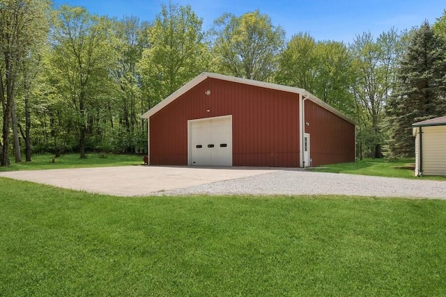 garage featuring a lawn