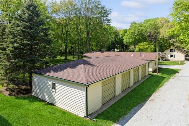 view of property exterior with a yard