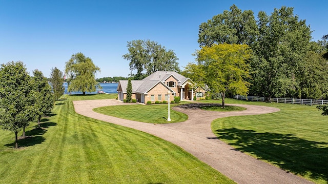 view of front of property featuring a water view and a front yard