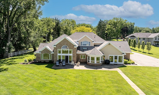 view of front facade with a patio area and a front lawn