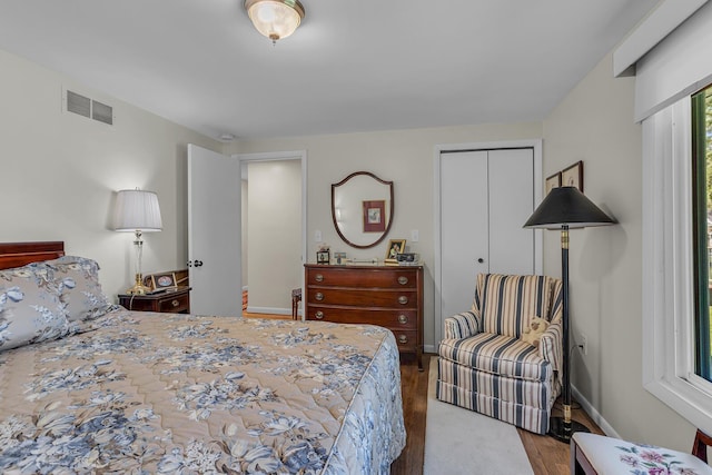 bedroom with wood-type flooring and a closet