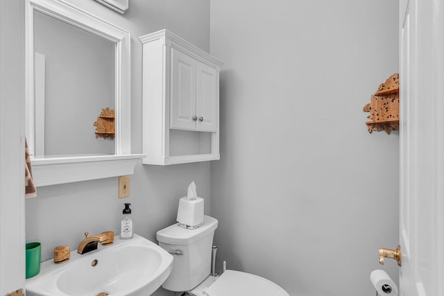 bathroom featuring sink and toilet