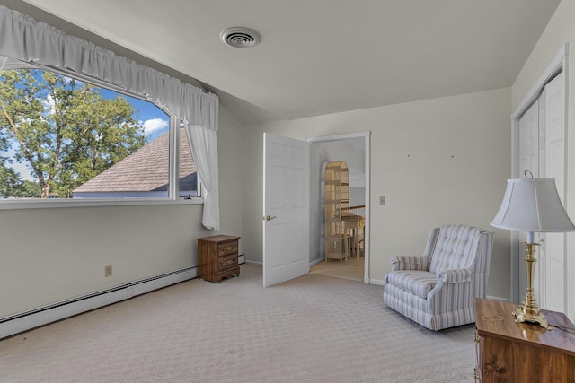 sitting room with light carpet and baseboard heating