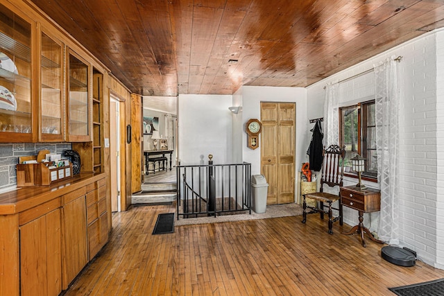 miscellaneous room with wooden ceiling and light wood-type flooring