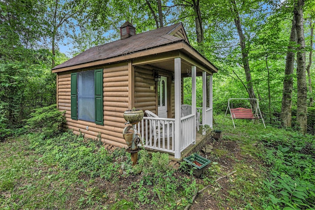 view of property exterior with a porch