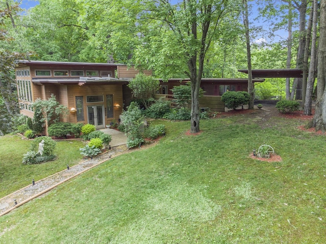 view of yard featuring french doors