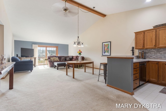 living area featuring high vaulted ceiling, light colored carpet, beamed ceiling, and ceiling fan with notable chandelier