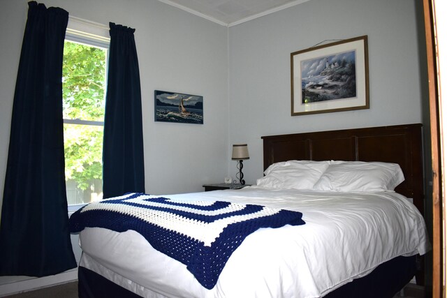 bedroom featuring ornamental molding